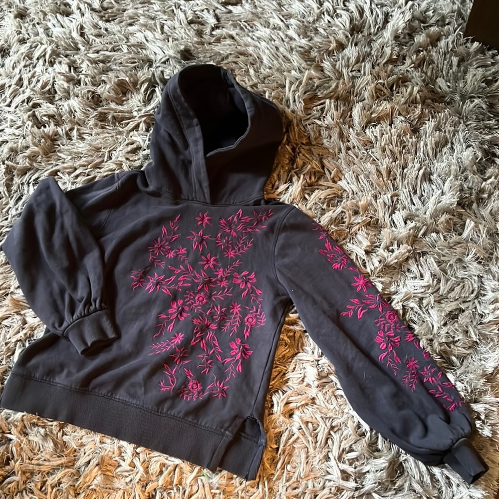 Black hooded sweatshirt with pink embroidered flowers